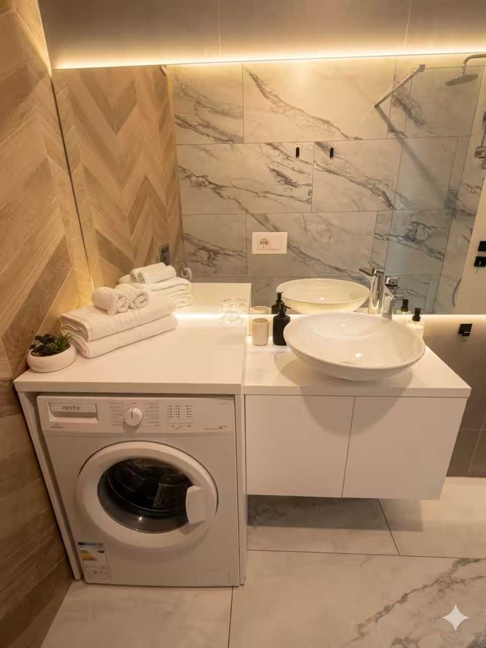 Un bagno con un lavandino bianco, uno scaldasalviette e una lavatrice — appartamento a Oradea